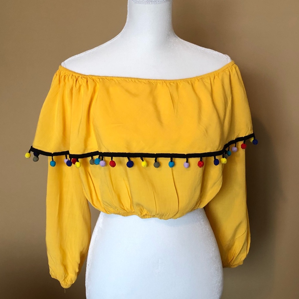 ASOS yellow crop top with pom pom tassels